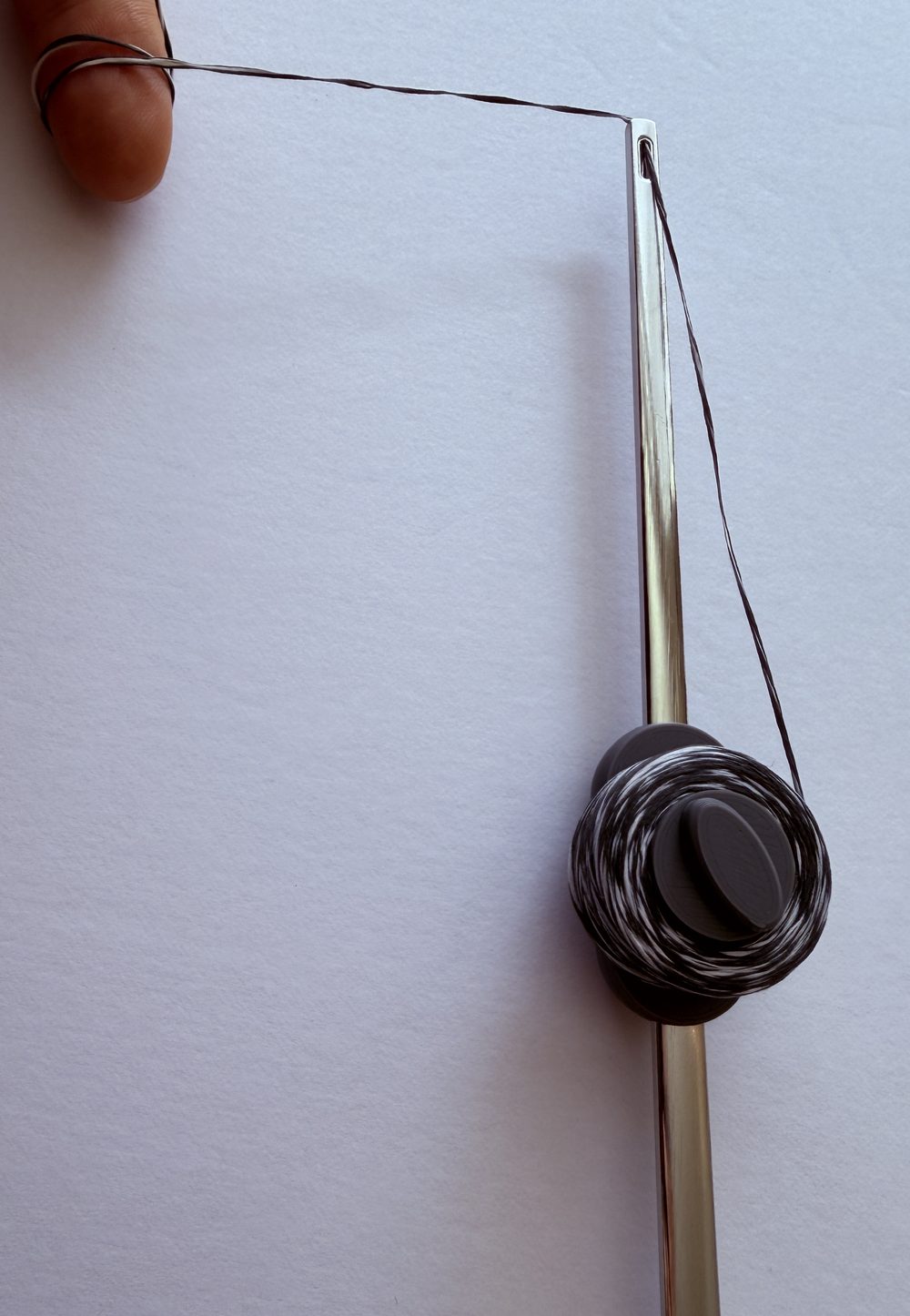 Drawing floss from the wand by hand